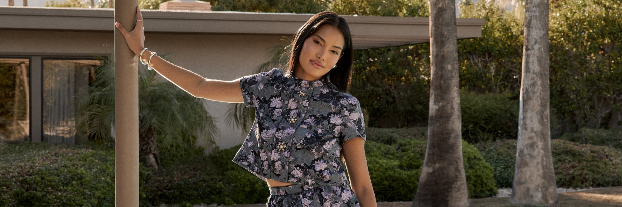 Woman wearing st john knits floral print skirt and matching jacket